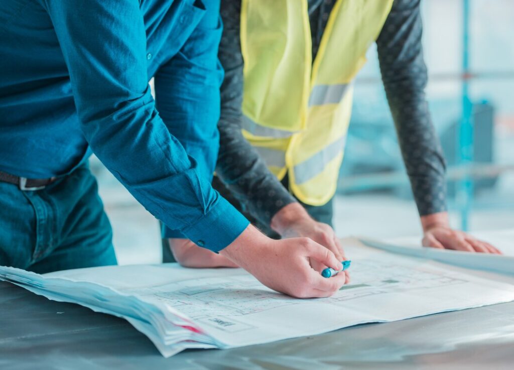 Workers checking out architectural plan project 114579 2771 1024x737
